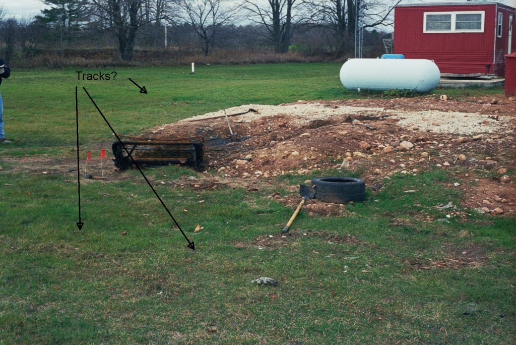 Tracks around burn pit before remains discovery (no tarp)